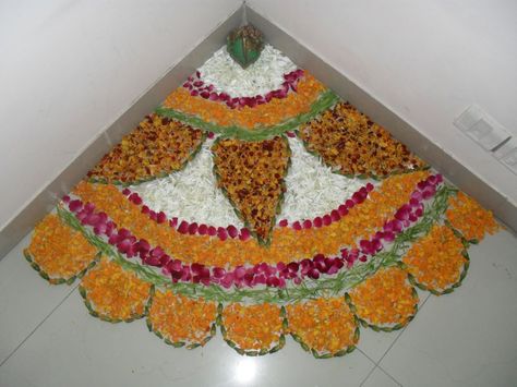 In earlier times, rangolis were made to feed the birds. This Diwali, go back to doing that. Instead of using artificial colours, make your rangoli with spices and other food items as follows: For white, use rice powder Yellow: Pulses or turmeric Brown: Cloves or cinnamon Green: Cardamom (chhoti elaichi) or fennel (saunf) Red: Dried chilly or even kumkum, if you wish You can even make a rangoli out of fresh flowers -- their fragrance is sure to create the perfect festive ambiance. Diwali Decoration Lights, Simple Flower Rangoli, Diwali Decoration Ideas, Diwali Decoration Items, Diwali Decorations At Home, Housewarming Decorations, Diy Diwali Decorations, Rangoli Patterns, Rangoli Ideas