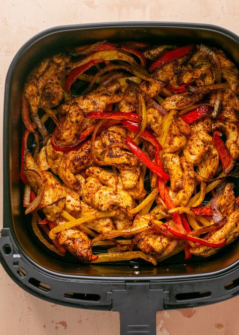 Quick and easy Air Fryer Chicken Fajitas are loaded with amazing flavor at only 150 calories and 2g net carbs per serving making it a great high protein low carb option! The chicken cooks up Frozen Chicken Fajitas, Fajitas In Air Fryer, Air Fryer Chicken Fajitas, Cook Frozen Chicken, Chicken And Peppers, Mexican Entrees, Isabel Eats, Homemade Fajita Seasoning, Chicken Fajita Recipe