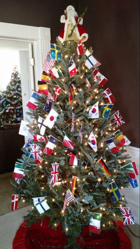 Flag Christmas Tree, Christmas Around The World Party Theme, Around The World Parade Float Ideas, Multicultural Holiday Decorations, Holidays Around The World Decorations, Christmas Decorations Around The World, Christmas Trees Around The World, Christmas Around The World Float Ideas, Christmas Around The World Parade Float