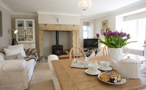 Kitchen /dining / living room . White and stone pale colours , very family cosy  Anna Www.melodymaison.co.uk Fireplace With Stove, Cottage Lounge, Kitchen Dining Living Room, Cottage Shabby Chic, Inglenook Fireplace, Cottage Inspiration, Cosy Living, Cottage Living Rooms, Cottage Interior