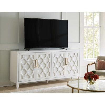 They work well as accent or entertainment cabinets with adjustable shelving and built-in wire management. These wood consoles have a raised pattern on the doors that resembles an intricate garden gate or trellis for climbing flowers. The fresh finish is accented with handles. Color: White | Wade Logan® Bekim 83" Console Table Wood in White | 37 H x 83 W x 19 D in | Wayfair Coastal Tv Stand, Console Table Wood, Climbing Flowers, Entertainment Cabinet, Entryway Console, Wire Management, Garden Gate, Table Wood, Accent Cabinet