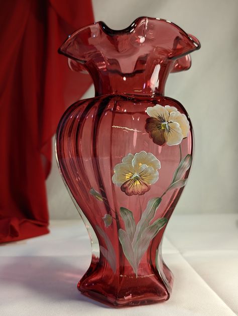 This is a very stunning Fenton Art Glass Piece that is hand painted by the artist M. Olmstead and is signed on the bottom.  This is the form # 1648 in the CW colour combination. It stands 8 3/4" tall and is 5" wide. It has no flaws or inclusions that I have found.  The vase is in excellent condition with no chips, cracks, scratches or other issues. Please See the Pictures for condition, sized and identification confirmation. Let's try together to encourage Upcycling and Repurposing.  This is the Vase Decorating Ideas, Vintage Pottery Vases, 80s Home, Red Vase, Glass Flower Vase, Vase Glass, Pretty Mugs, Glass Flower Vases, Colour Combination