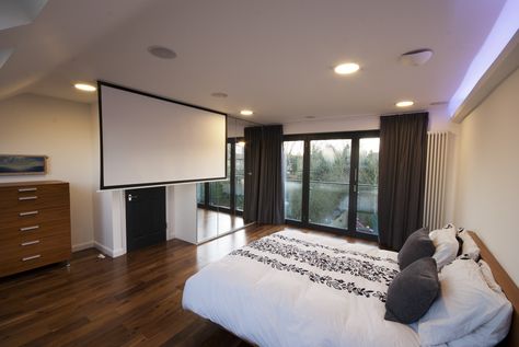 loft conversions bedroom with french doors and a cinema screen built into the ceiling Loft Conversion Design, Projector In Bedroom, Loft Bedrooms, Cinema Screen, Bedroom Ceilings, Loft Conversion Bedroom, Loft Extension, Interior Paint Colors For Living Room, French Doors Bedroom