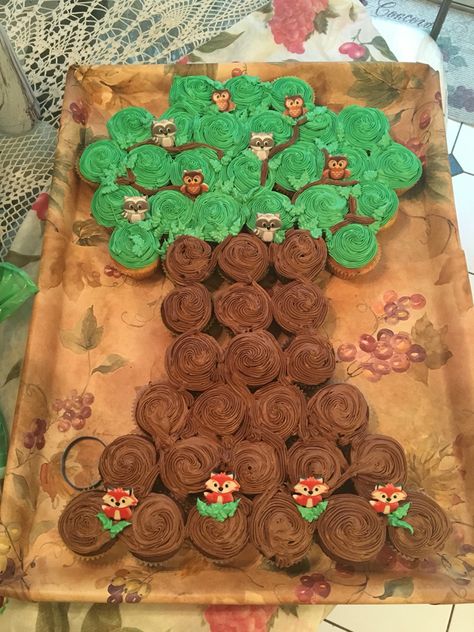 Woodland creature tree cupcake cake Baby Shower Boy Cupcakes, Woodland Baby Shower Theme Decorations, Woodland Baby Shower Theme Boy, Woodland Baby Shower Food, Boy Cupcakes, Popular Baby Shower Themes, Woodland Creatures Baby Shower, Woodland Baby Shower Decorations, Forest Baby Showers