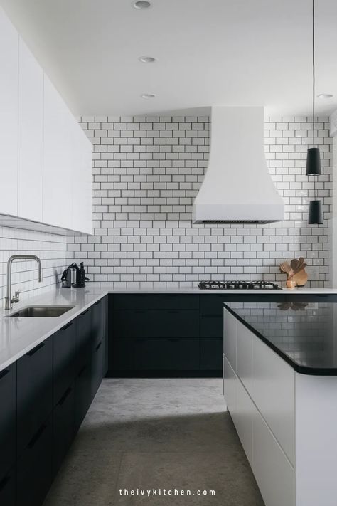 Modern kitchen with white subway tiles, black cabinets, and a sleek island. Black White Kitchen Ideas, Modern Black Cabinets, Aesthetic Black Kitchen, Luxury Black Kitchen, Black Lower Cabinets, Black Kitchen Inspiration, Ivy Kitchen, Black Kitchen Ideas, White Upper Cabinets