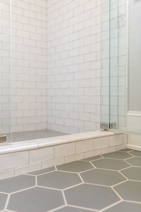 Shower And Floor Tile Combo Ideas, Bathroom Slate Floor White Subway Tile, White Shower Stall Tile Ideas, Walk In Shower White Subway Tile, Subway Tile Bathroom Shower Walk In, Gray Hexagon Tile Bathroom, Gray Subway Tile Bathroom, White Subway Tile Shower Ideas, Shower Subway Tile