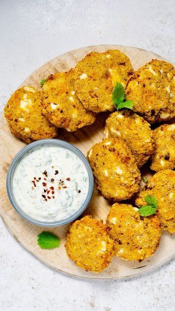 Ainsley Harriott Food Company on Instagram: "Air Fryer Moroccan Butternut Squash, Feta and Couscous Patties: easy and delicious 😋 

These butternut squash and couscous patties are crispy, delicious and easy to prepare using an air fryer. Our Moroccan Medley adds great flavour and texture. Perfect for a healthy sharing snack served with a yoghurt dip or serve with veg or a side salad for a tasty light lunch or dinner. 
 
Makes approx. 10
 
1 small butternut squash, peeled, cubed
½ tsp ground cumin
Olive oil, for drizzling and spraying
 
1 x packet of Ainsley Moroccan Medley Couscous
1 egg
30g breadcrumbs
1 tbsp grated Parmesan cheese (optional)
80g feta, crumbled
½ tsp chilli flakes 
Sea salt & freshly ground black pepper
 
Mint & Coriander Dip:
150g Greek Yoghurt
1 tbsp finely chopped cor Couscous Patties, Yoghurt Dip, Light Lunch, Company Meals, Air Fryer Recipes Healthy, Side Salad, Couscous, Butternut Squash, Air Fryer Recipes