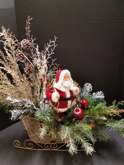 Santa Claus coming to town on his sled. Designed by Mary Bui for Michael store in Mission Viejo, Ca Christmas centerpiece 2017 Sleigh Decor, Christmas Sleigh Decorations, Xmas Centerpieces, Christmas Centers, Christmas Flower Arrangements, Christmas Floral Arrangements, Christmas Centerpieces Diy, Country Christmas Decorations, Easy Christmas Decorations