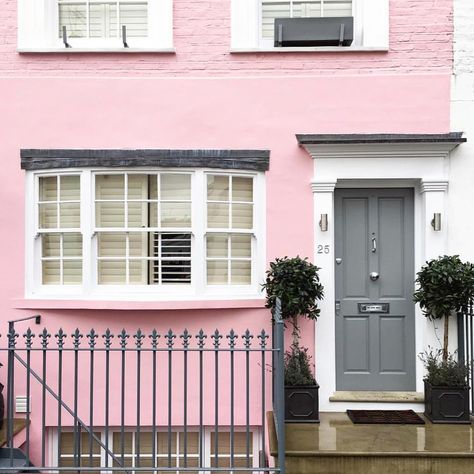 Pink house paint exterior with gray painted door. Pink And Grey House Exterior, Exterior Pink Paint Colors, Pink House Exterior Color Combinations, Pink Paint Color Palette, Pink Paint Colors Sherwin Williams, Southern Paint Colors, Best Exterior Paint Colors, Pink House Exterior, Home Paint Colour