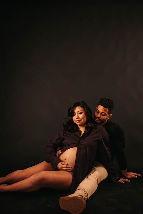 black paper backdrop studio maternity session in button up and underwear with pregnant mama at cultivate studios in colorado springs. editoral maternity session Studio Maternity Shoot Black Woman, Studio Maternity Shoot Black Couple, Maternity Photography Black Backdrop, Black And White Studio Maternity Shoot, Red Maternity Dress, Fine Art Maternity Photography Studio, Studio Maternity Shoot, Nature Photoshoot, Black Backdrops