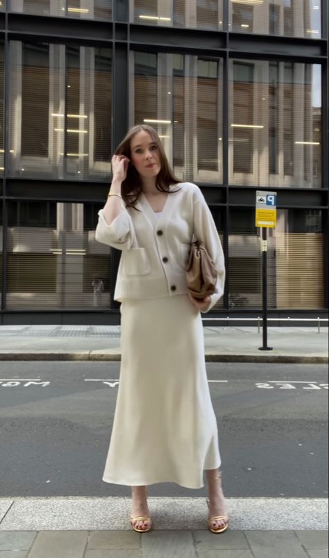 Cardigan And Satin Skirt, White Silk Skirt Outfit Winter, Silk Skirt And Cardigan Outfit, Satin Skirt And Cardigan Outfit, Cream Winter Dress, Ivory Silk Skirt Outfit, Ootd Rok Satin, Cream Silk Skirt Outfit, Champagne Satin Skirt Outfit