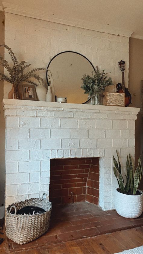 Fireplace Mantle Decor Boho, White Brick Mantle Decor, Boho Modern Mantle Decor, Modern Boho Fireplace Mantle Decor, Mantle Above Wood Stove, Brick Mantle Fireplace, Fireplace Boho Decor, Boho Fireplace Ideas, Red Brick Fireplace Mantle