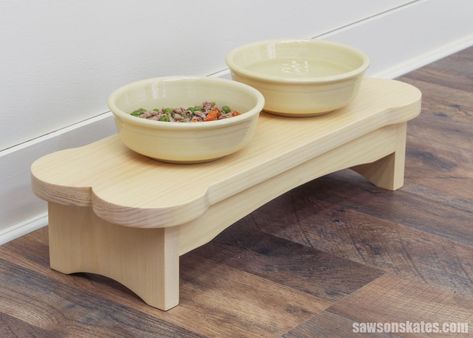 Level up your pup's feeding time with this adorable DIY dog bowl stand! Crafted in the shape of a bone, it raises your small dog's food and water bowls, making them easier to reach. Step-by-step tutorial and free templates included. Dog Bowls Diy, Diy Dog Bowl Stand, Diy Dog Bowl, Raised Dog Bowl Stand, Pet Feeder Station, Diy Dog Gate, Diy Dish, Dog Stairs, Woodworking Plans Beginner