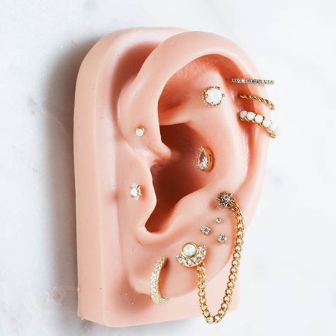 Gold + white opal is such a gorgeous combo ✨ What would you add/take away from this ear?! ☺️ . . . . . . . . . . #piercingjewelry #piercedandproud #piercingideas #piercingsofinstagram #piercinglove #lovepiercings #piercinginspiration #eari Piercing Ideas Aesthetic, Ear Piercing Ideas Aesthetic, Curated Ear Piercing With Industrial, Opal Ear Piercings, Opal Piercing Ears, Opal Piercing, Opal Curated Ear, Industrial On Small Ear, Ear Piercing Ideas