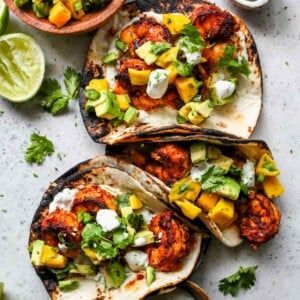 Chipotle Shrimp Tacos with Avocado-Mango Salsa - Dishing Out Health Chipotle Shrimp Tacos With Avocado-mango Salsa, Shrimp Tacos Mango Salsa, Tacos Mango Salsa, Shrimp Tacos With Mango Salsa, Chipotle Shrimp Tacos, Mango Pico, Healthy Shrimp Tacos, Tacos With Mango Salsa, Dishing Out Health