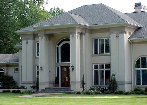 Dramatic Exterior with Flattened Columns and White Stucco Finish Stucco Exterior Trim Ideas, White Stucco White Trim, Stucco House White Windows, Traditional Stucco Home Exterior, Home Exterior Stucco And Stone, Scored Stucco Exterior, House Columns, White Exterior Houses, Classical House