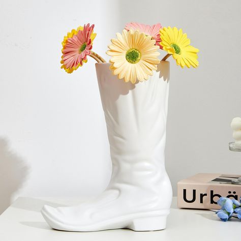 PRICES MAY VARY. 🌷【UNIQUE BOOT VASES】- This boot vase takes long boots as the prototype, using exquisite ceramic craftsmanship to imitate the shape of the shoes. The designer's exquisite design showcases modern artistic style. 🌷【CERAMIC MATERIALS】- Our flower vase is made of ceramic，presenting a matte luster. Imitating the wrinkles of leather boots with ceramic materials, injecting color into monotonous life. The overall appearance is generous, meticulous and durable. 🌷【FLOWER ARRANGEMENTS】- Flower Arrangements Unique, Modern Aesthetic Room, Room Wedding Decor, Cowboy Boot Vase, Western Centerpieces, Cowboy Home Decor, Boot Planter, Boot Vase, Ceramic Vases Design