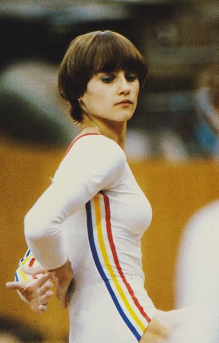 Nadia Comaneci, athlete who won gold with 10/10 score in each round in 1974 Olympic Nadia Season, Nadia Comaneci Perfect 10, Gymnastics Uniforms, Berlin Style, Nadia Comaneci, Acrobatic Gymnastics, Sport Bikinis, Gymnastics Pictures, Olympic Gymnastics