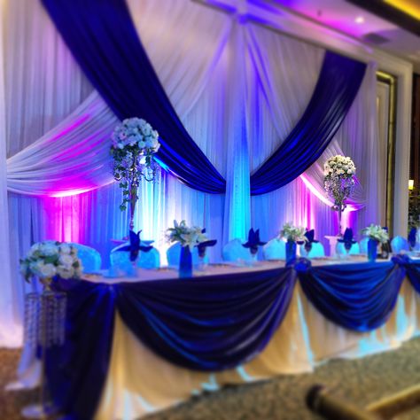 Head table decor & rentals Quince Court Table Blue, Wedding Main Table Decorations, Royal Blue Quinceanera Decorations, Quince Court Table, Main Table Wedding, Centerpieces Vases, Royal Blue Quince, Royal Blue Quinceanera, Blue Purple Wedding