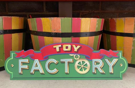 75cm wide by 23cm tall.A vintage inspired 'Toy Factory' Sign, the perfect sign for any Elf Workshop, Christmas Grotto or Winter Wonderland this December. I designed this for my own Elves workshop. I felt the workshop I was building had become more of a factory with all the fake buttons and gadgets, but I struggled to see any toy factory signs for sale already, only Elves workshop signs. Printed in Christmas colours directly onto 6mm MDF wood and cut to shape, this sign can easily be propped on a Toy Factory Christmas, Christmas Toy Factory, Workshop Signs, Elves Workshop, Elf Workshop, Christmas Grotto, Wood Props, Xmas 2024, Christmas Colours