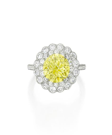 Fancy Vivid Yellow Diamond and Diamond 'Flower' Ring, Tiffany & Co. Designed as a flowerhead, centering a round Fancy Vivid Yellow diamond weighing 3.01 carats within a surround of near colorless round diamonds, the shank further highlighted with round diamonds, size 6¼, signed Tiffany & Co., numbered 30420098. With signed box. Diamond Rings Tiffany And Co, Diamond Rings Tiffany, Rings Tiffany And Co, 3 Carat Diamond Ring, We're Engaged, 3 Carat Diamond, Jewelry Real, Tiffany Jewelry, Wedding Goals