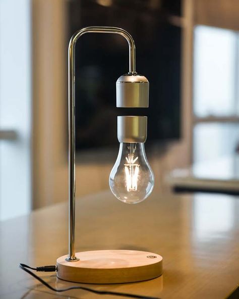 This remarkable lamp not only illuminates your space with a gentle, warm glow but also astonishes with its unique levitating light bulb, held aloft by the power of magnets. The magic extends beyond mere levitation. Hidden within the lamp’s base is a powerful wireless phone charger, discreetly blending technology with function. 🔍 Product: Levitating Lamp (Wireless Charger) 👆 Tap the link in bio for more lamps! . . . . . . . . . . . . . . . . . . #decorcrushing #interior4u #interior4inspo #sa... Levitating Lamp, Wireless Light Bulb, Night Stand Lamp, Stylish Bedroom Decor, Luminaire Original, Floating Table, Apartments Decorating, Wireless Lights, Decorating Farmhouse