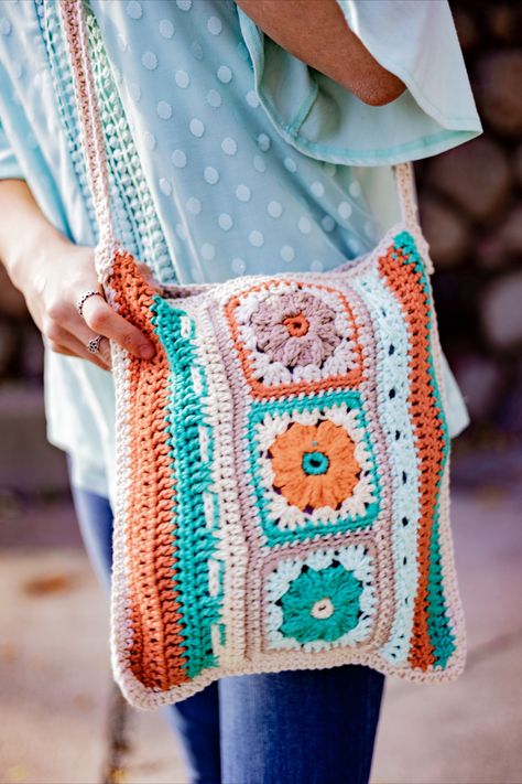 Libbie is a small shoulder bag that can be completed in a weekend. Made of two sides of the same basic design, the panels are joined on three sides and the top is edged in single crochet. The design of the bag is a strip of three granny squares with textured flowers and rounds. Along both sides of the granny strip are rows made of a variety of stitches to keep you interested. Finishing touches include a loop and wood toggle button closure and a crocheted shoulder strap sewn to the bag sides. Shoulder Bags Pattern, Crochet Bag Pattern Free, Bag Pattern Free, Toggle Button, Basic Design, Crochet Round, Crochet Tote, Crochet Bag Pattern, Granny Squares