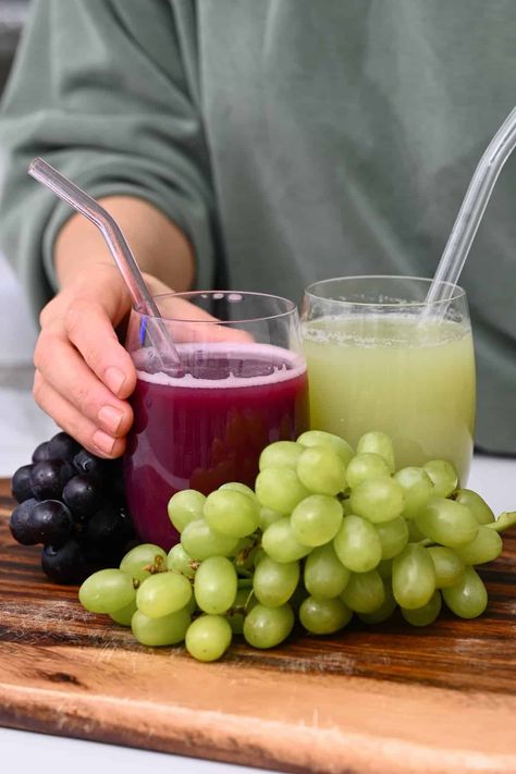 Two grasses with red and green grape juice and grapes around them How To Make Grape Juice From Green Grapes, Green Grape Juice, How To Make Grape Juice, Grapes Juice, Green Grape Juice Recipe, Homemade Grape Juice Recipe, Homemade Grape Juice, Grape Juice Recipe, Beet Juice Recipe