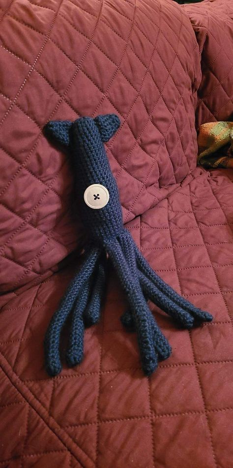 Squid from coraline crochet blue body, one button eye Squid Crochet Pattern Free, Squid From Coraline, Coraline Crochet Pattern, Squid Crochet Pattern, Coraline Squid, Crochet Squid, Crochet Things, Crochet Inspo, Pattern Tutorial