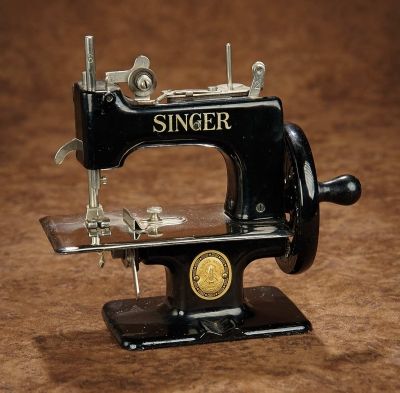 Child's Metal Toy Sewing Machine by Singer - 6" (15 cm.) The painted black metal toy sewing machine has chrome plate and accessories, wooden-handled wheel, and original brass medal plaque, "The Singer Man'f Co Trademark", and is gilt lettered "Made in Italy". Excellent condition. Circa 1900. Z Sewing For Men, Toy Sewing, T Shirt For Men, Sewing Machine, For Men, Sewing, T Shirt