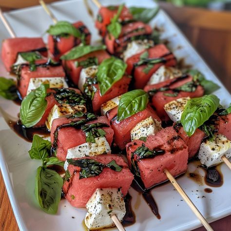 🍉 Enjoy bite-sized delights with Watermelon and Feta Skewers! 🧀 #PartyPerfect 🍽️ Watermelon and Feta Skewers 🛒 Ingredients: Watermelon: 2 cups, cubed Feta cheese: 1 cup, cubed Fresh basil leaves Balsamic glaze: For drizzling 👩‍🍳 Instructions: Skewer: Alternate watermelon, feta, and basil on skewers. Drizzle: Top with balsamic glaze before serving. 🌟 Light and refreshing, our Watermelon and Feta Skewers are perfect for your next gathering! #FetaFun Watermelon Feta Skewers, Watermelon Appetizer, Weekly Recipes, Instagram Recipes, Watermelon And Feta, Twisted Recipes, Watermelon Salad, Trending Recipes, Balsamic Glaze