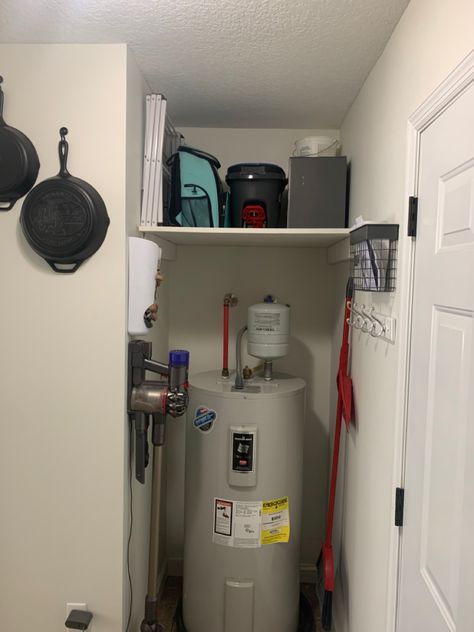 See the full laundry room redo for 300$ dollars! Large shelf over water heater to avoid wasted space Shelf Over Hot Water Heater, Water Heater Laundry Room, Water Heater Closet Storage, Hot Water Heater Closet, Hide Water Heater, Water Heater Closet, Furnace Room, Laundry Room Redo, Building Shelves