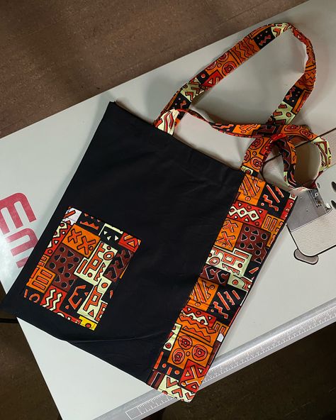 Afrocentric tote bag design made for a customer Price N4500 #totebag #totesteeshub #weddingsouvenirnigeria #topqualitytotebags #totebagsinabuja #madeinabuja #brandsouvenir #brandedtote #weddinggiftitems #weddingsouvenirs #weddingtotebagdesigns #totebags #totebagsforstudent Ankara Tote Bag, Tote Bag Design Ideas, Chitenge Outfits, Jute Bags Design, African Head Scarf, Tot Bag, Ankara Bags, Bags Fabric, African Bag