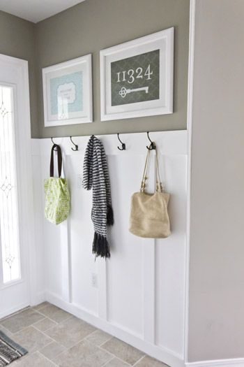 another angle of this entryway. Loving the hooks, the chair rail, the colour, the pictures - everything! Formal Room, Concrete Basement, Diy Wainscoting, Young House Love, Basement Ceiling, Bench Ideas, Basement Walls, Ceiling Ideas, Playroom Ideas