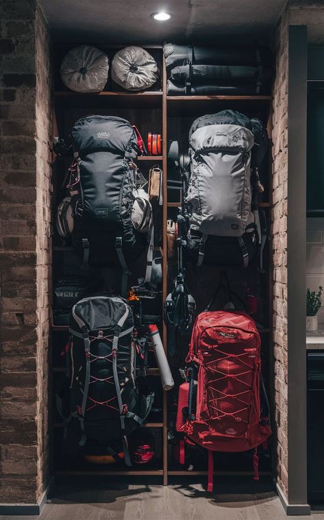 An urban apartment with a compact backpacking gear wall and efficiently stored outdoor equipment. Backpacking Storage, Gear Room Organization, Outdoor Gear Organization, Gear Closet, Gear Organization, Gear Wall, Gear Room, Chill Room, Tool Storage Diy