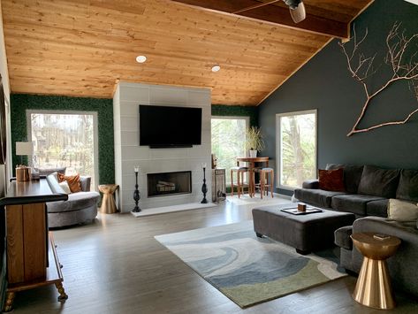 Cozy living room with all the style stunts! Slanted cedar ceiling, copper TREE BRANCH hanging on wall, and faux living wall frames large windows by flirting with the landscape outside! Asymmetrical Ceiling Living Room, Slant Ceiling Living Room, Slanted Ceiling Living Room Decor, Living Room With Slanted Ceiling, Slanted Wall Living Room, Cedar Ceiling Living Room, Half Vaulted Ceiling Living Room, Angled Ceiling Living Room, Slanted Ceiling Living Room