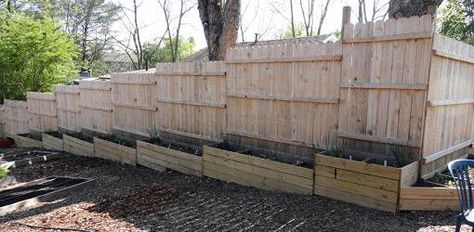 Raised bed planters used to fill the gaps at the bottom of the fence above. Zen Rock Garden Ideas, Raised Bed Planters, Sloping Garden, Build A Fence, Backyard Fence Decor, Yard Makeover, Sloped Yard, Zen Rock Garden, Backyard Canopy