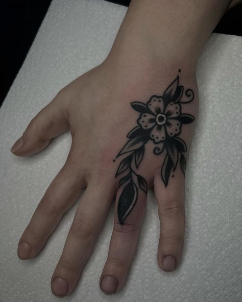 Old finger tattoo cover up with the traditional flower piece done by our resident @nicole__tattoo Books with Nicole/info in our Bio: @southgatetattoo • • • #coveruptattoo #coverup #floraltattoo #handtattoos #flower #blackflower #sgtattoo #southgatetattoo Cover Up Tattoos On Hand, Finger Coverup Tattoo, Finger Tattoo Cover Up, Hand Cover Up Tattoos, Hand Tattoo Cover Up Ideas, Nicole Tattoo, Hand Tattoo Cover Up, Traditional Heart Tattoos, Traditional Heart