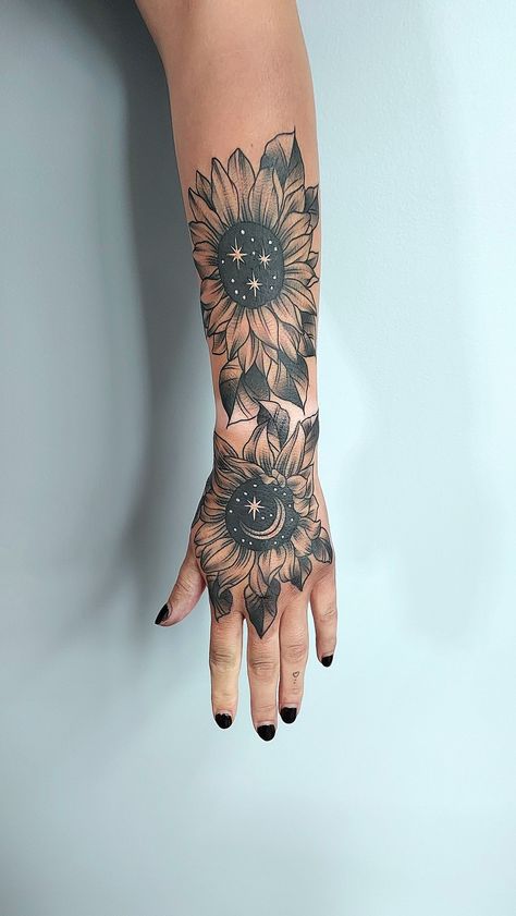 black and grey cosmic sunflower tattoo Hand Tattoos For Women Sunflower, Sunflower Leg Tattoo Sleeve, Celestial Sunflower Tattoo, Cosmic Sunflower Tattoo, Cosmic Flower Tattoo, Sunflower Hand Tattoos For Women, Hand Tattoos For Women Cover Up, Gothic Sunflower Tattoo, Hand Sunflower Tattoo