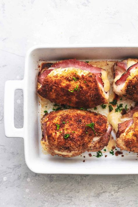 overhead view of four chicken bundles in a casserole dish Dijon Cream Sauce, Ham Fried Rice, Ham And Bean, Cordon Bleu Recipe, Chicken Cordon Bleu Recipe, Cordon Blue, Winter Picnic, Leftover Ham Recipes, Juicy Pork Chops