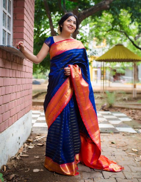 This Kanjivaram silk saree with Veldhari work is the epitome of classical beauty and timeless tradition. The rich blue body is offset by a vibrant red border embellished with elephant and horse patterns. Simple gold studs and a center parted braid adorned with flowers completed Ramya Subramaniam's look! Saree: Tulsi Silks  Make-up and hair-do: Page3salon Simple Gold Studs, Tulsi Silks, Blue Silk Saree, Kanjivaram Sarees Silk, Saree Wearing Styles, Saree Wearing, Saree Draping Styles, Kota Silk Saree, Pattu Saree Blouse Designs