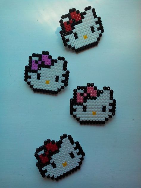 perle a repasser modele tete hello kitty Hama Beads Hello Kitty, Perler Beads Hello Kitty, Princess Perler Beads, Pixel Hello Kitty, Emo Hello Kitty, Hama Disney, Princesses Disney, Perler Crafts, Iron Beads