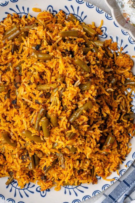 Lubia Polo is a Persian Green Bean Rice, with fluffy rice and layers of a rich tomato sauce filled with green beans and is absolutely delicious! Bean And Rice, Bean Rice, Persian Rice, Persian Recipes, Persian Green, Fluffy Rice, Persian Cuisine, Persian Food, Prep Recipes