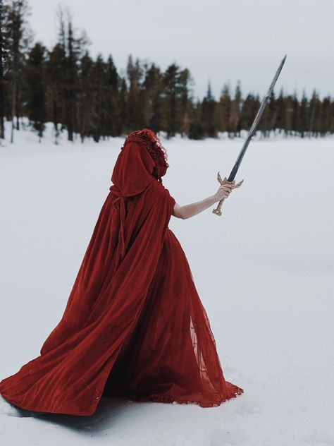 Snow White Dress Gowns, Dark Snow White Aesthetic, Winter Fairytale Aesthetic, Red Dress In Snow, Red Cloak Aesthetic, Red Cape Aesthetic, Red Knight Aesthetic, Red Princess Dress Fairytale, Lady In Red Aesthetic