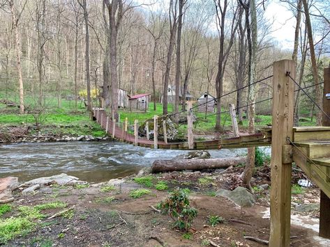 Rent this charming cabin for the weekend along with its very own suspension bridge! Small Creek Bridge, Rustic Bridge Over Creek, Wood Bridge Over Creek, Stream With Bridge, Small Bridge Over Stream, Airbnb Rentals, Relaxing Places, Suspension Bridge, Local Travel