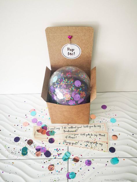 "Bridesmaid Proposal Box- Pop me balloon - will you be my bridesmaid - bridesmaid proposal balloon - bridesmaid gifts- bridesmaid box A perfect way to \"pop\" the question - literally! A cute and pretty gift to ask those special in your life to be part of your big day. Crystal clear balloon, filled with foil confetti in shades purple, Teal and rose gold foil confetti & our unique blend of sparkles. Presented  in a 10x10cm box. Name tags are  automatically printed on linen card, giving a luxuriou Teal And Rose Gold, Balloon Proposal, Clear Balloon, Blowing Up Balloons, Wedding Roles, Balloon Box, Clear Balloons, Personalized Balloons, Balloon Pop