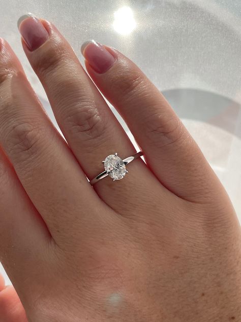 New In from our 2022 collection!  💎This simplistic but absolutely beautiful engagement ring features 1.5CT oval cut  white D color Moissanite stone on a minimal 1.8mm sterling silver band. Truly elegant and timeless design.  💎Made of high quality sterling silver and plated with rhodium it will not rust or turn your finger green. Center stone size - 6mm*8mm(1.5Ct) Color Grade - D Clarity Grade- VVS1 Cut: Excellent  Material:  Fine Sterling Silver 925 Plating: Rhodium    💎Comes with authenticit Oval Engagement Ring With, Mossianite Engagement Rings Silver, Silver Oval Moissanite Engagement Ring, Oval Silver Band Engagement Ring, Simple Wedding Rings Silver Oval, All Silver Engagement Ring, Timeless Engagement Ring White Gold, Engagement Rings Oval Platinum, Silver Oval Diamond Ring