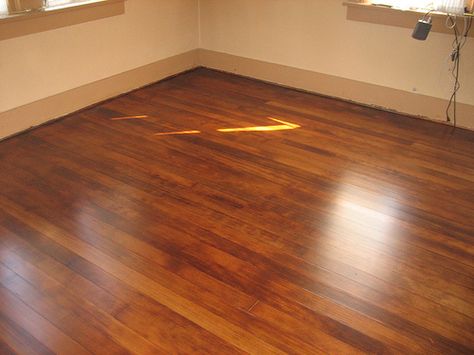 I like this color stain.  He used American walnut stain as a base with some red mahogany dye mixed in Refinished Floors, Fir Floors, Rental Remodel, Bungalow Remodel, Douglas Fir Flooring, Oak Timber Flooring, 1920s Bungalow, Table Redo, Hardwood Floor Colors