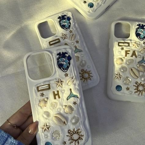 "Introducing latest trend straight out of Pinterest to you all. : custom silicon phone cases adorned with charms and pearls! Personalize yours to reflect your unique style and make your phone truly stand out." DM to order💌 [ phonecase, pinterest, pinterestphonecase, siliconphonecases, pinterestinspired, seashellphonecase] #charmsjewelry #phonecase #pinterest #pinterestphonecase #siliconphonecases #pinterestinspired #pinteresttrending #seashellphonecase Charm Phone Cases Diy, Memor Phone Cases, Charm Phone Cases, Memor Phone Case, Silicon Phone Cases, Seashell Phone Case, Beach Phone Case, Shell Phone Case, Summer Phone Cases