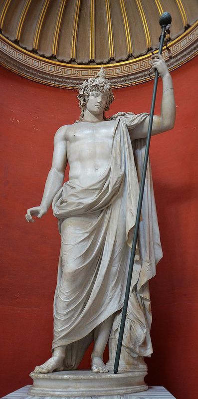 Colossal statue of Antinous as Dionysus-Osiris, he holds the thyrsus (a Dionysian attribute) and wears a ivy crown, and a diadem which at the top would originally have held a cobra (uraeus) or a lotus flower, Antinous Braschi, Vatican Museums | da Following Hadrian Dionysus Statue Aesthetic, Egyptian Interior, Dionysus God, God Dionysus, Ivy Crown, Greek Pantheon, Greek Statues, Roman Gods, Ancient Statues